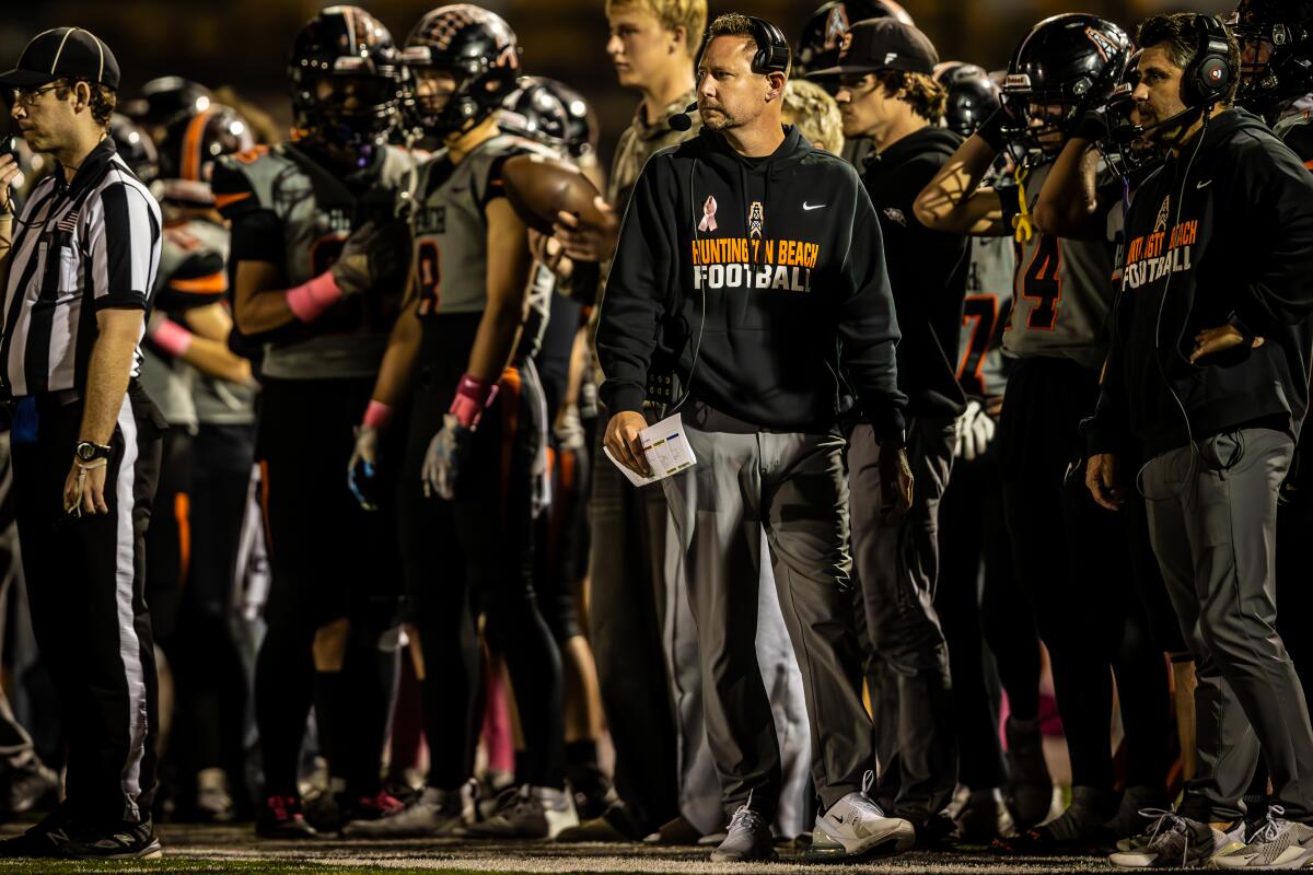 Huntington Beach coach Brett Brown looks on in the first quarter against La Habra on Friday in an Epsilon League game.