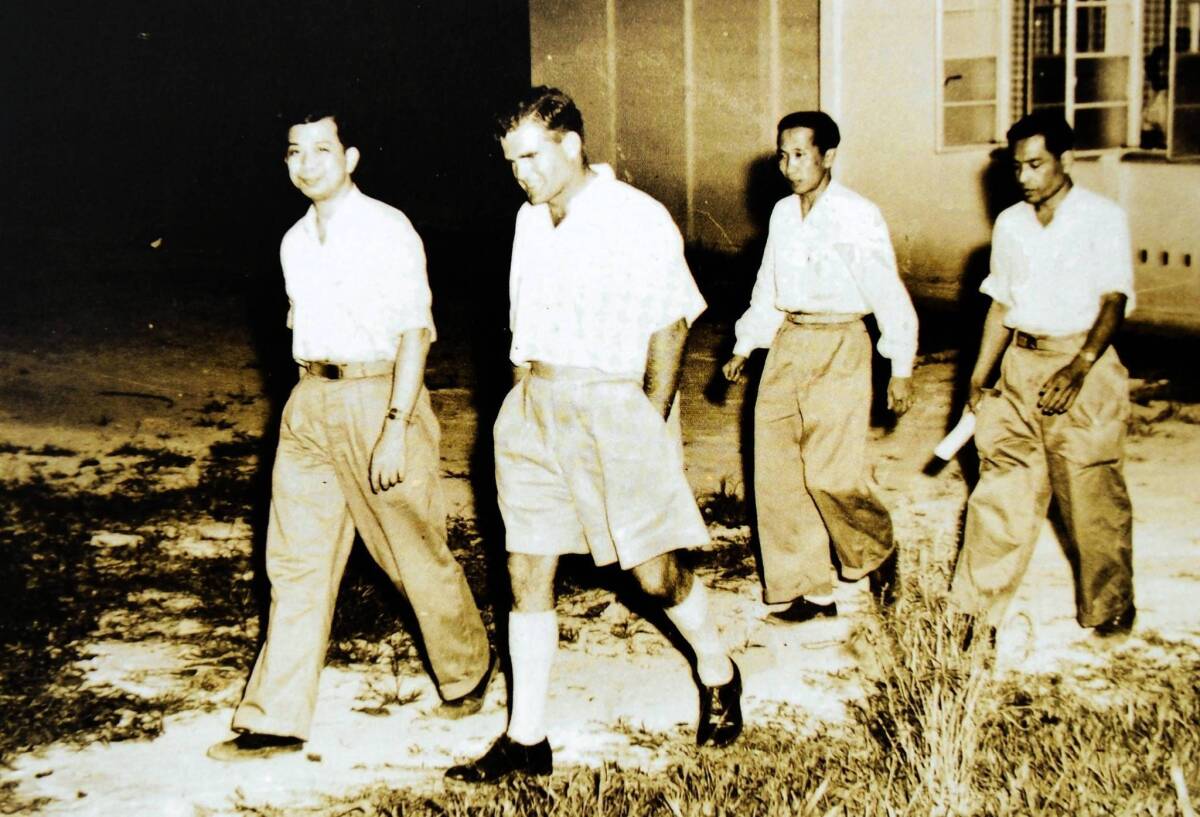 Chin Peng, left, is shown during negotiations in 1955 between his Communist Party of Malaya and the British-ruled Malaysian government. He fled to China in 1960 and was never allowed to return to Malaysia.
