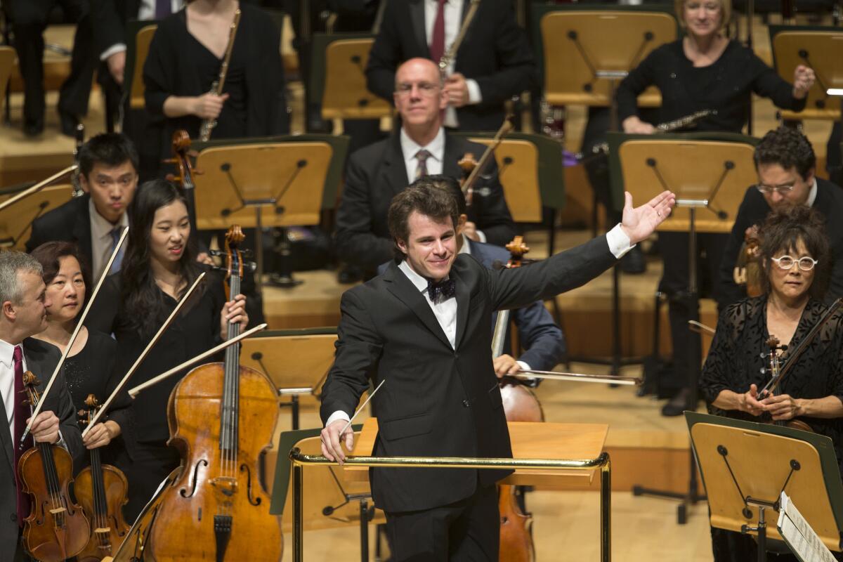 Jakub Hrusa acknowledges the crowd after conducting the Los Angeles Philharmonic at Walt Disney Concert Hall.