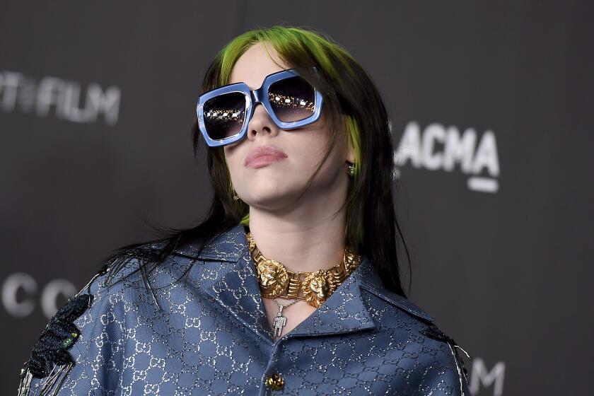 FILE - This Nov. 2, 2019 file photo shows Billie Eilish at the 2019 LACMA Art and Film Gala in Los Angeles. Eilish will be the first recipient of the Apple Music Award for global artist of the year, one of three honors for the pop singer. Apple announced Monday that Eilish’s “When We All Fall Asleep, Where Do We Go?” has been named album of the year. Eilish and her brother Finneas will also receive songwriter of the year honors. (Photo by Jordan Strauss/Invision/AP, File)
