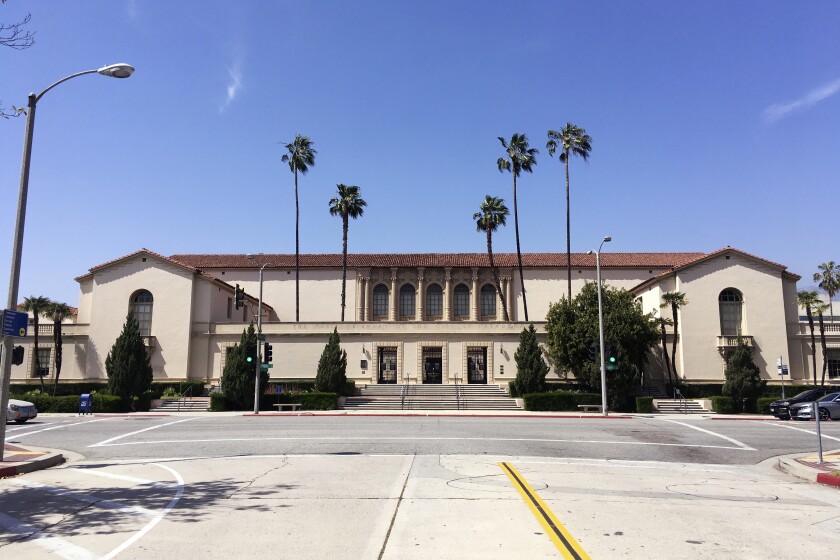 The city of Pasadena's historic Central Library stands empty Wednesday, May 5, 2021, after being ordered closed pending further review due to seismic safety concerns. The nearly century-old Mediterranean Revival-style building had just reopened for in-person services following a pandemic closure when the closure order was issued Monday, the city said in a statement. A recent structural assessment revealed that most of the building is constructed with unreinforced masonry bearing walls that support concrete floors and walls. (AP Photo/John Antczak)