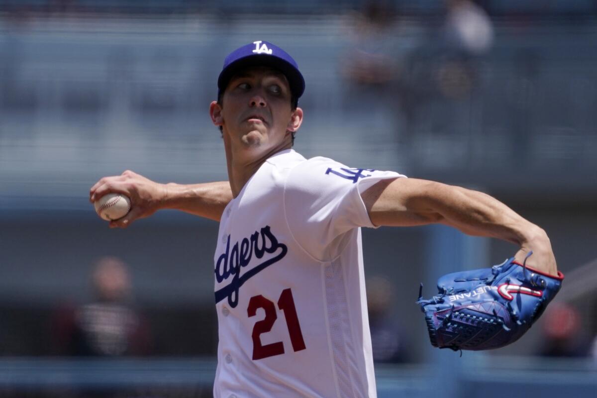 Dodgers pitcher Walker Buehler throws to the plate during the first inning against the Arizona Diamondbacks.