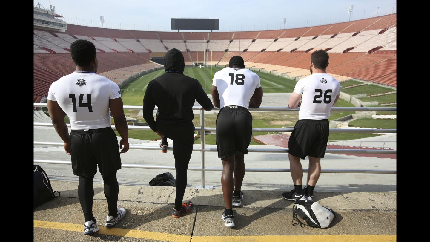 Wiley Brown, Desmond Haynes, Herbert Law and Chris Skinner (left to right) check out the view inside the Coliseum, site of a rugby combine to evaluate skills on Jan. 12.