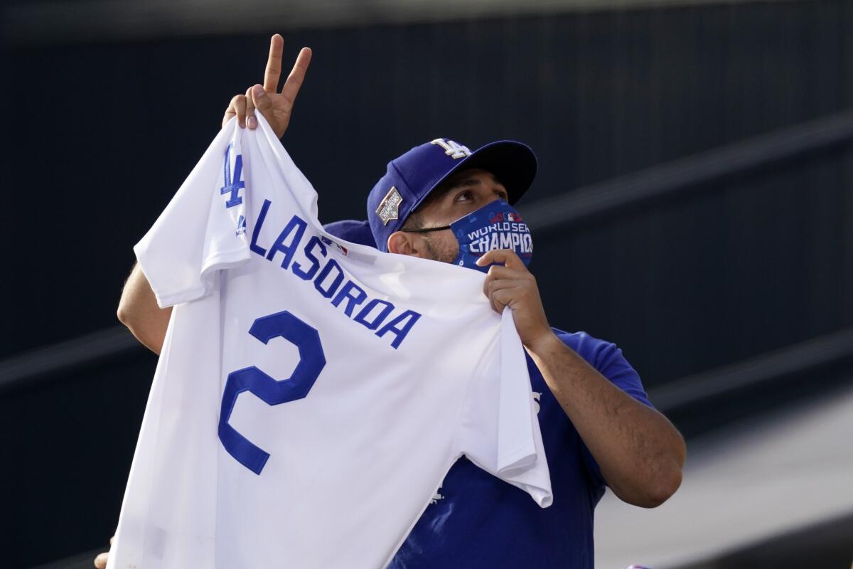 A fan gestures as he watches a video that honored the late Tommy Lasorda on April 10, 2021.