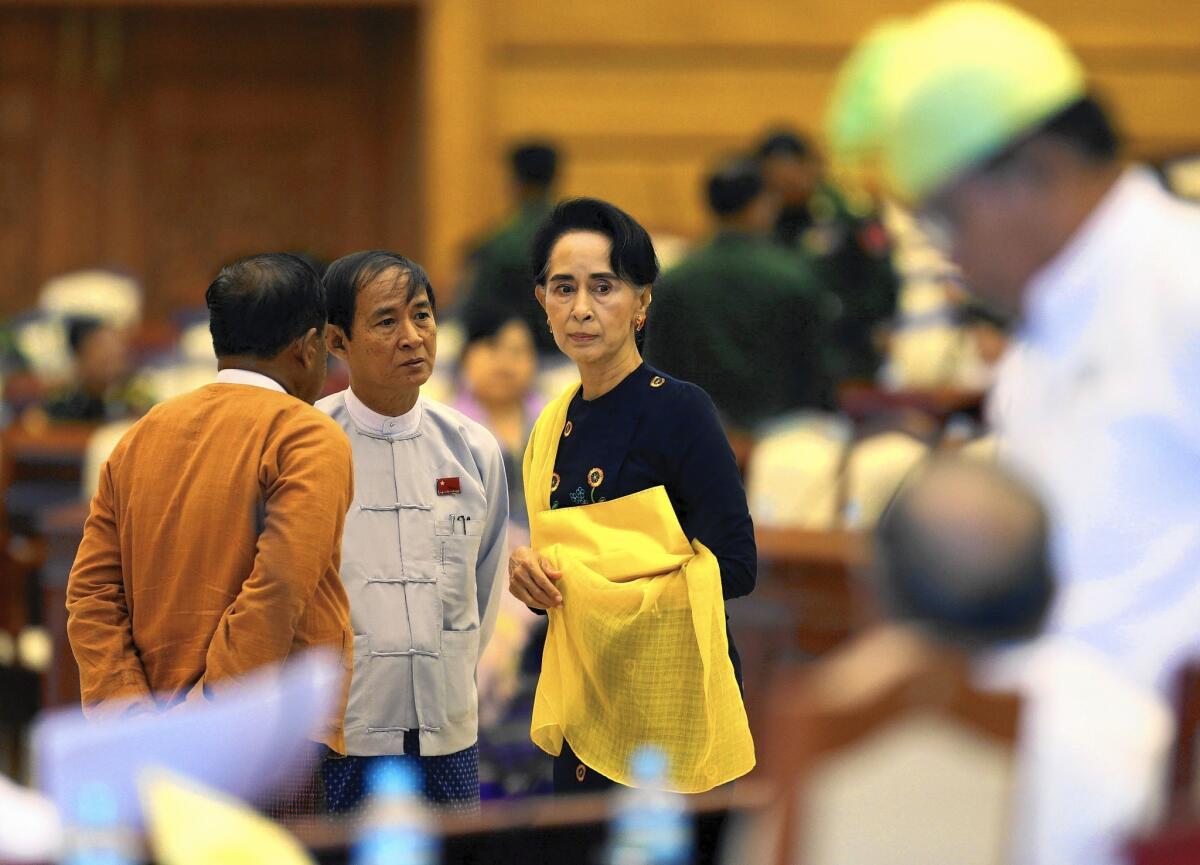 Myanmar's Aung San Suu Kyi leaves parliament on Nov. 18, 2015. How she exercises power after her party's landslide win could determine the future of the nation's tentative democratic transition.