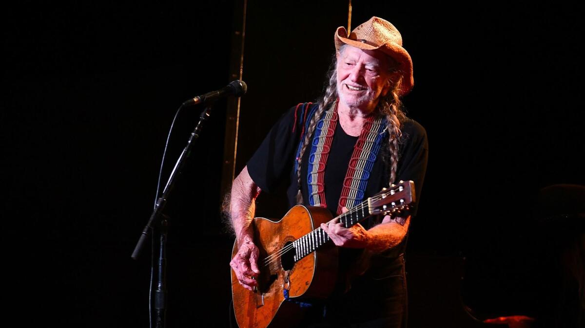 Willie Nelson performs at the Shrine Auditorium in Los Angeles in August.