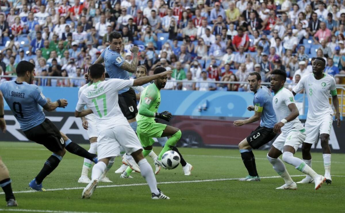 Uruguay's Luis Suarez scores the lone goal in a Group A match against Saudi Arabia on June 20.