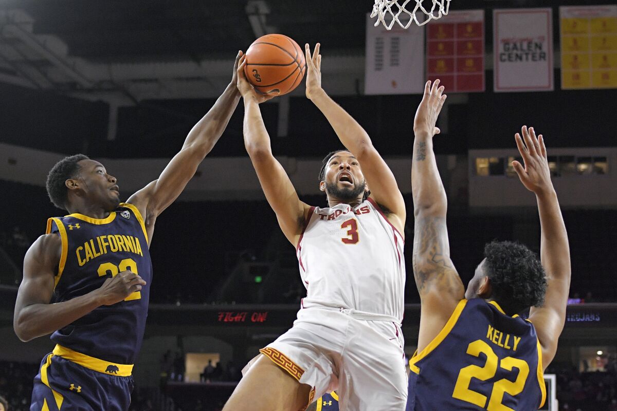 USC forward Isaiah Mobley shoots as California forward Andre Kelly and guard Jalen Celestine defend during the first half.
