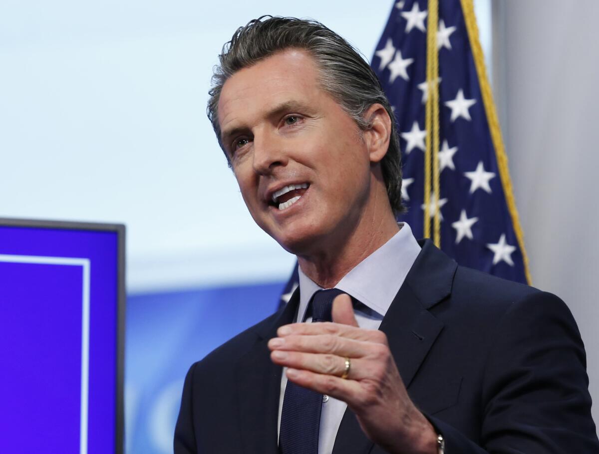 California Gov. Gavin Newsom speaks at a news conference.