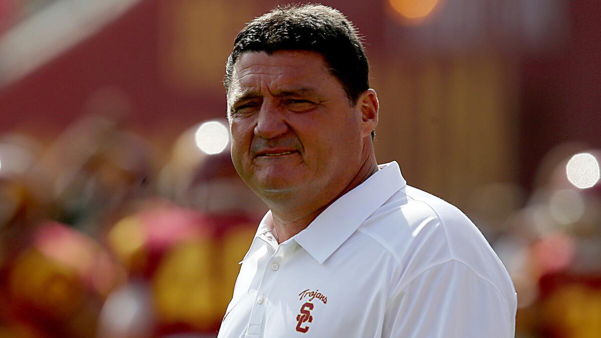 USC interim head coach Ed Orgeron watches his players warm up before a game against Utah in October 2013. Orgeron has been hired as Louisiana State's defensive line coach.