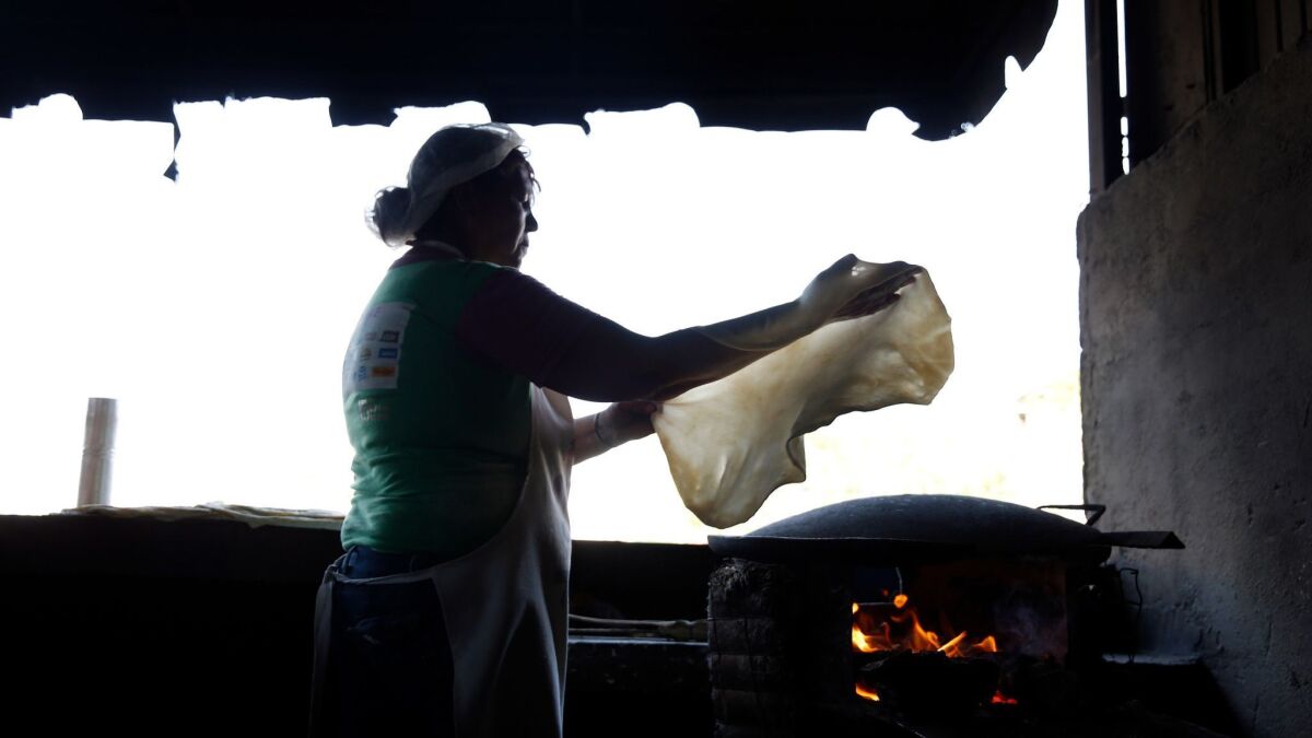 Ramona Ruiz prepares tortillas de agua, sometimes called sobaqueras, at Tortillas y Burros Doña Guille in Hermosillo, Mexico.