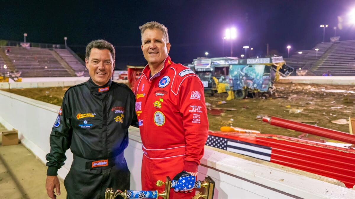 Costa Mesa Police Chief Ron Lawrence, left, with Fire Chief Dan Stefano at the 2022 Motorhome Madness Demolition Derby.