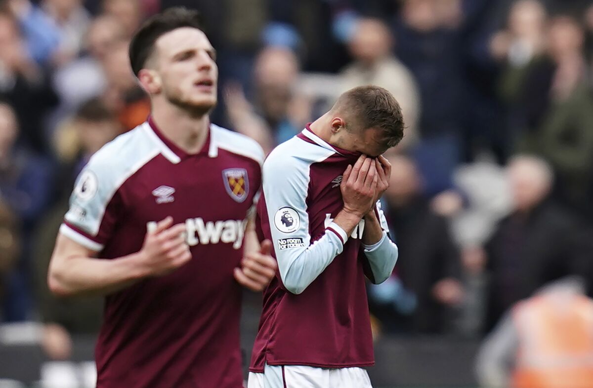 West Ham United's Andriy Yarmolenko reacts after scoring their side's first goal of the game during their English Premier League soccer match against Aston Villa at the London Stadium, London, Sunday, March 13, 2022. (John Walton/PA via AP)