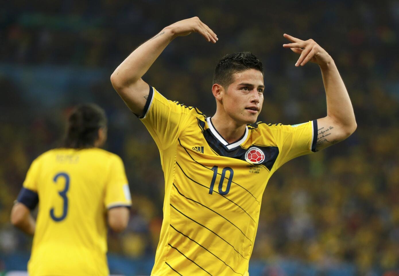 Colombia's James Rodriguez celebrates after scoring his second goal during the 2014 World Cup round of 16 game between Colombia and Uruguay at the Maracana stadium