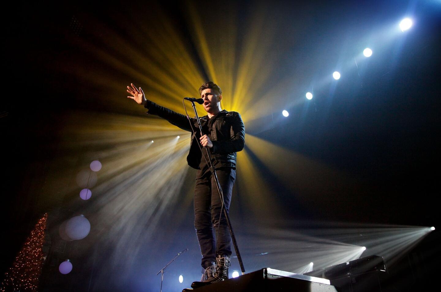 David Paden Marchand, a.k.a. Davey Havok, lead vocalist of the band AFI, plays to the crowd Saturday.