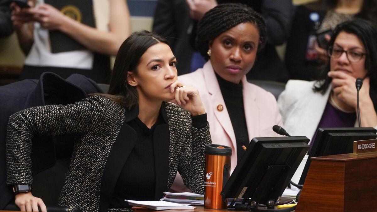 Democratic Reps. Alexandria Ocasio-Cortez (left), Ayanna Pressley and Rashida Tlaib listen during a House committee hearing on Feb. 26. All three are first-term members of Congress; two defeated incumbent Democrats in their primary elections.