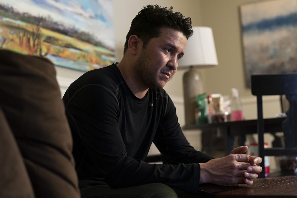 Hasibullah Hasrat, 29, is interviewed at his apartment, in Hyattsville, Md., Wednesday, May 4, 2022. (AP Photo/Jacquelyn Martin)