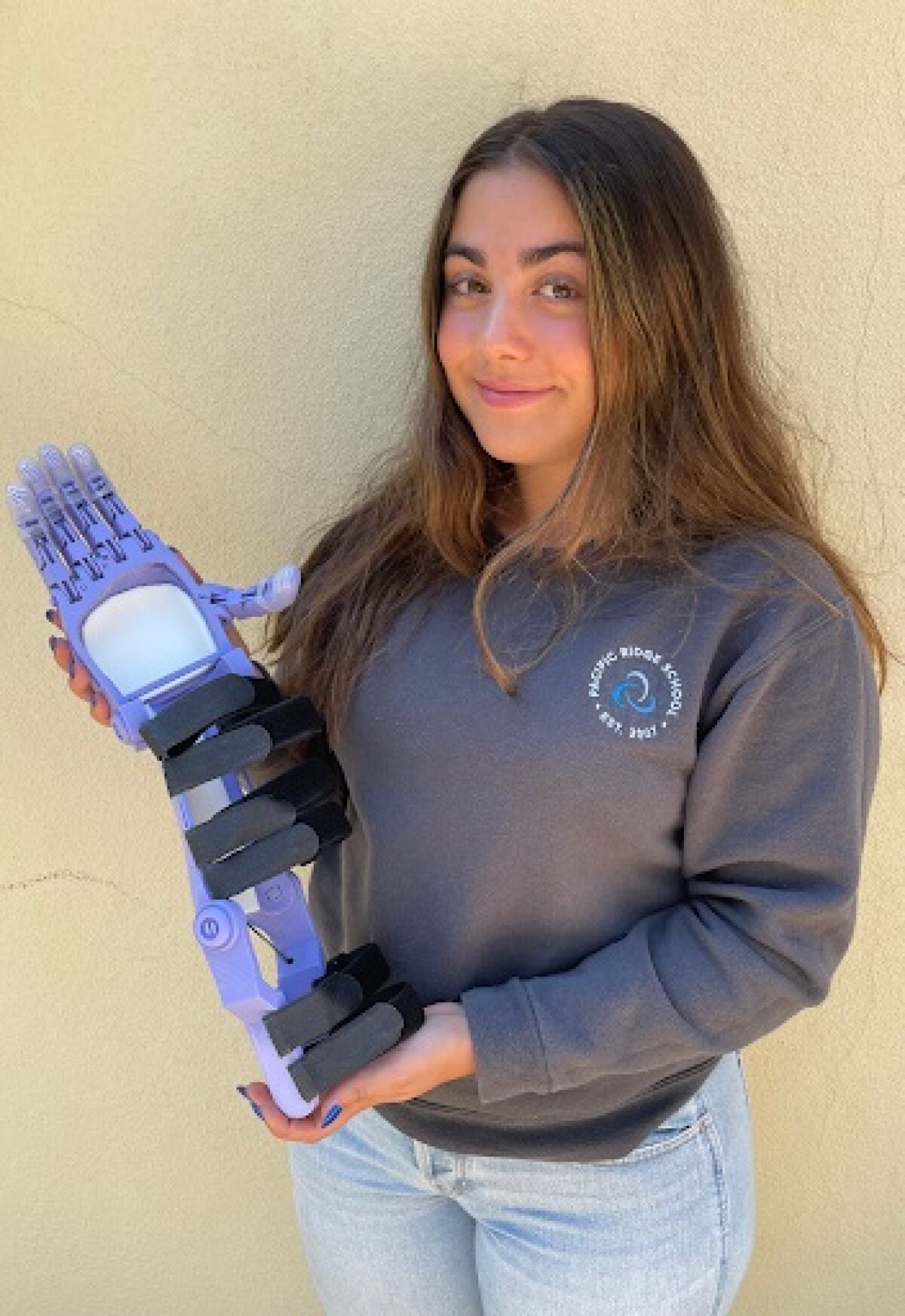 Isabella Balikian with the custom, 3D-printed arm.