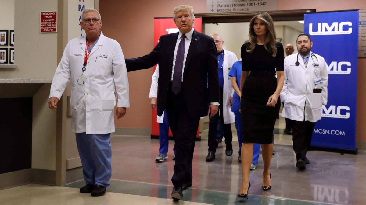 President Trump and First Lady Melania Trump with Dr. John Fildes, a surgeon at University Medical Center in Las Vegas, after meeting with survivors of the mass shooting.