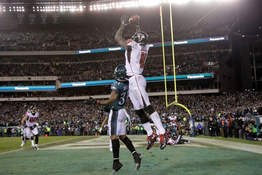 Atlanta Falcons' Julio Jones (11) cannot catch a pass against Philadelphia Eagles' Jalen Mills (31) during the second half of an NFL divisional playoff football game, Saturday, Jan. 13, 2018, in Philadelphia. (AP Photo/Matt Rourke)