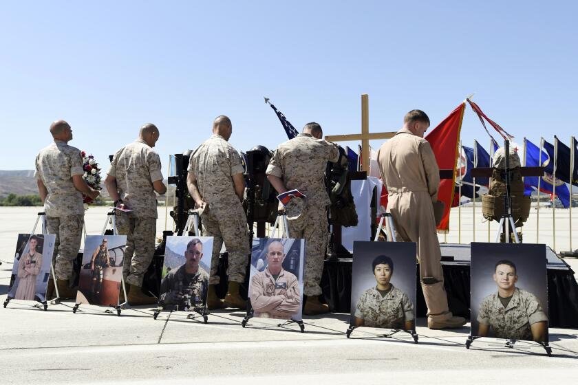 Marines at Camp Pandleton pay tribute at a memorial service in June for six fellow Marines killed in a helicopter crash while helping with disaster relief in Nepal.