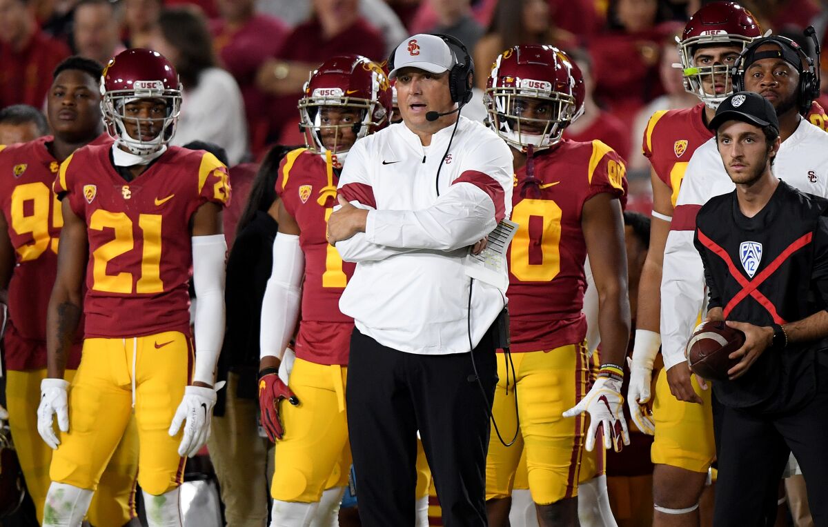 USC coach Clay Helton watches play from the sidelines during the first half against Arizona at the Coliseum on Oct. 19.