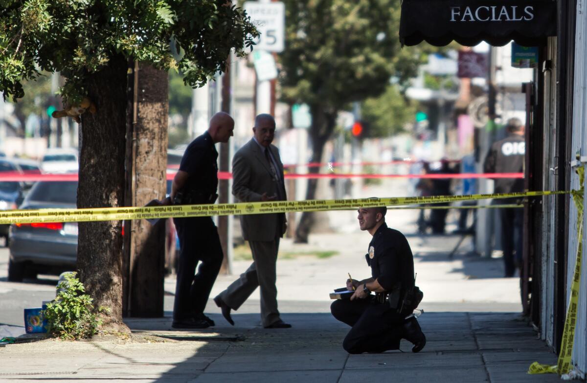 Los Angeles police investigate after officers fatally shot a woman near East 22nd and San Pedro streets near downtown L.A. in September 2015.