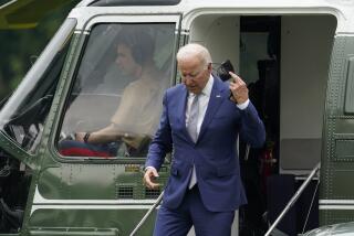 President Joe Biden removes his mask as he steps off Marine One on the South Lawn of the White House, Tuesday, June 14, 2022, in Washington. Biden is returning to Washington after speaking at the AFL-CIO convention in Philadelphia. (AP Photo/Patrick Semansky)