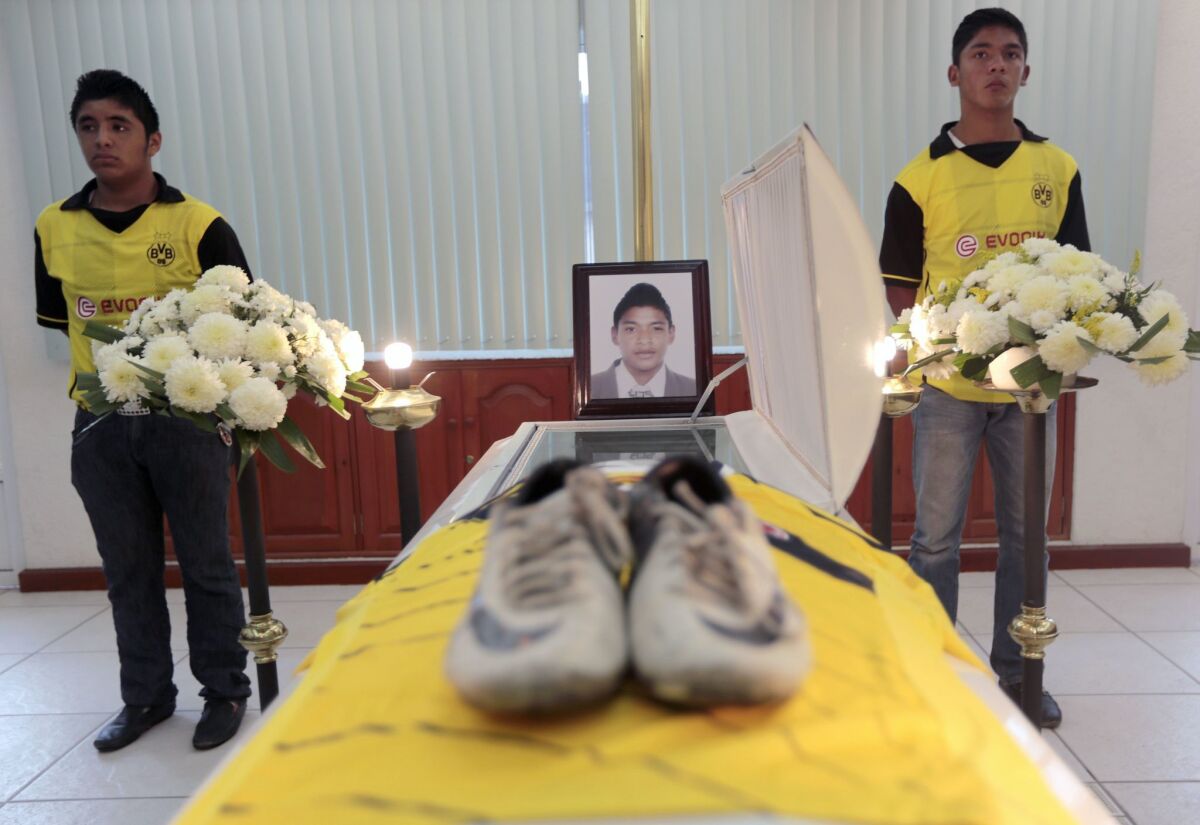 Teammates of soccer player David Garcia attend his funeral in Chilpancingo, Guerrero state, Mexico, on Saturday.