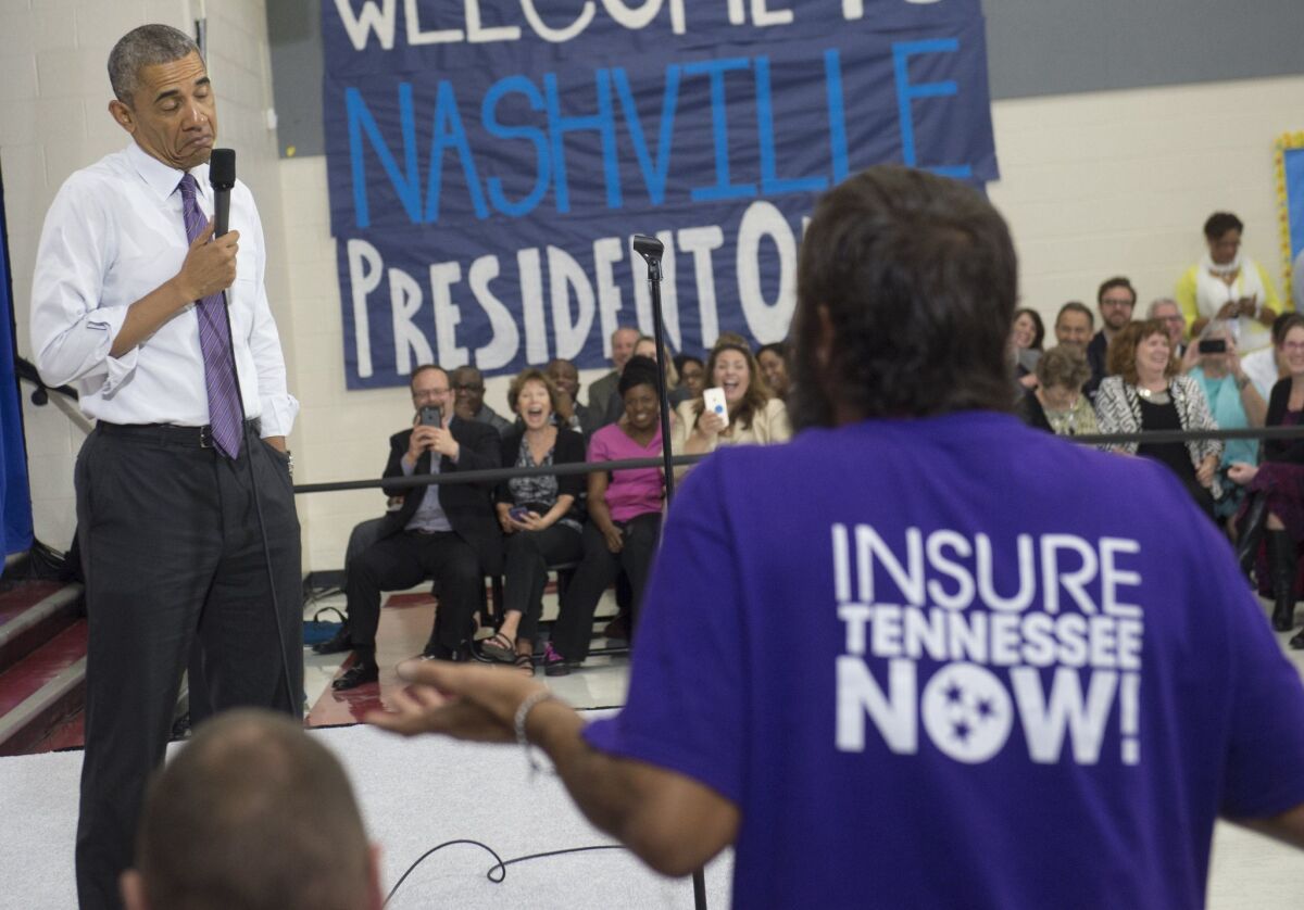 President Obama takes a question about the Affordable Care Act at a Tennessee forum in July.