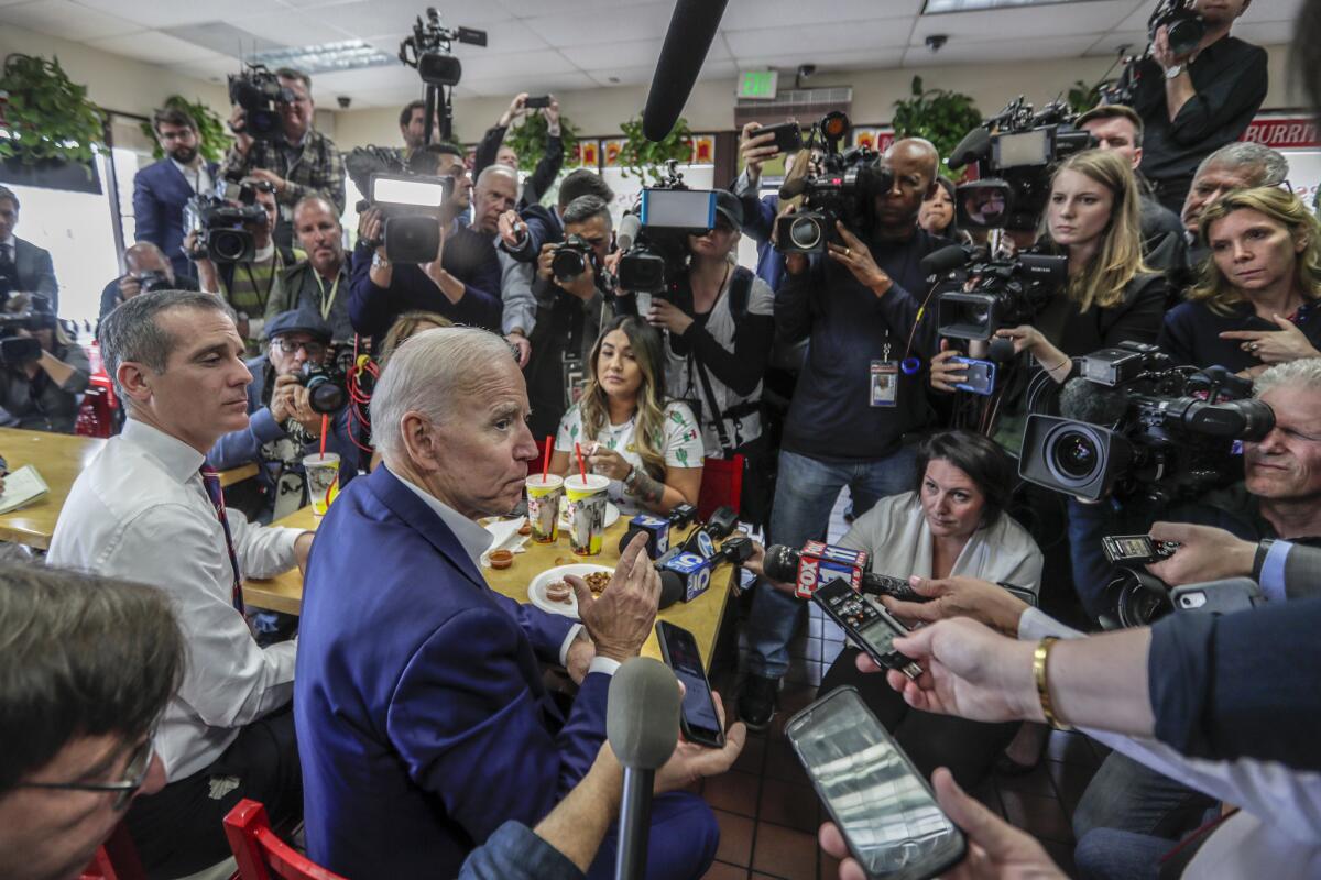 L.A. Mayor Eric Garcetti and Joe Biden speak to members of the media at King Taco amid the Democratic presidential primaries.