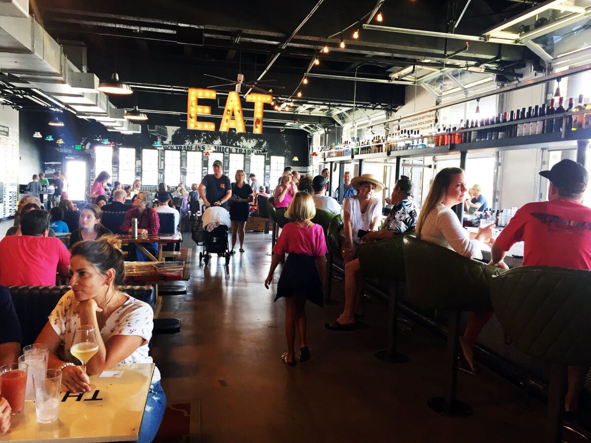 A photo of diners at Windmill Food Hall on Sept. 2. The 12,000-square-foot dining destination, inside the ground floor of the iconic Carlsbad windmill building, opened on Sept. 1.