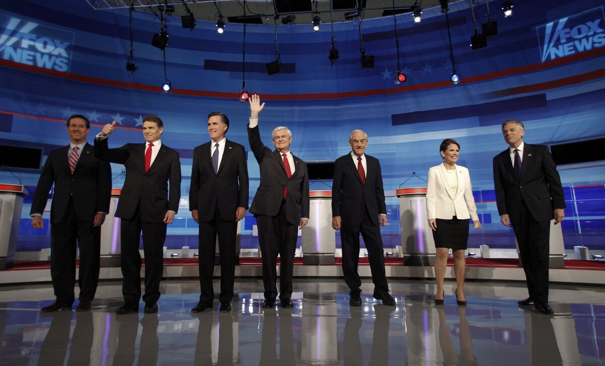 Republican presidential candidates line the stage for a Republican presidential debate in Sioux City, Iowa, in 2011.