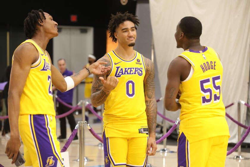 LOS ANGELES, CA - OCTOBER 2, 2023 - Los Angeles Lakers #21 Maxwell Lewis, #0 Jalen Hood-Schifino and #55 D'Moi Hodge joke around at Los Angeles Lakers Media Day at the UCLA Health Training Center in El Segundo on October 2, 2023. (Genaro Molina / Los Angeles Times)