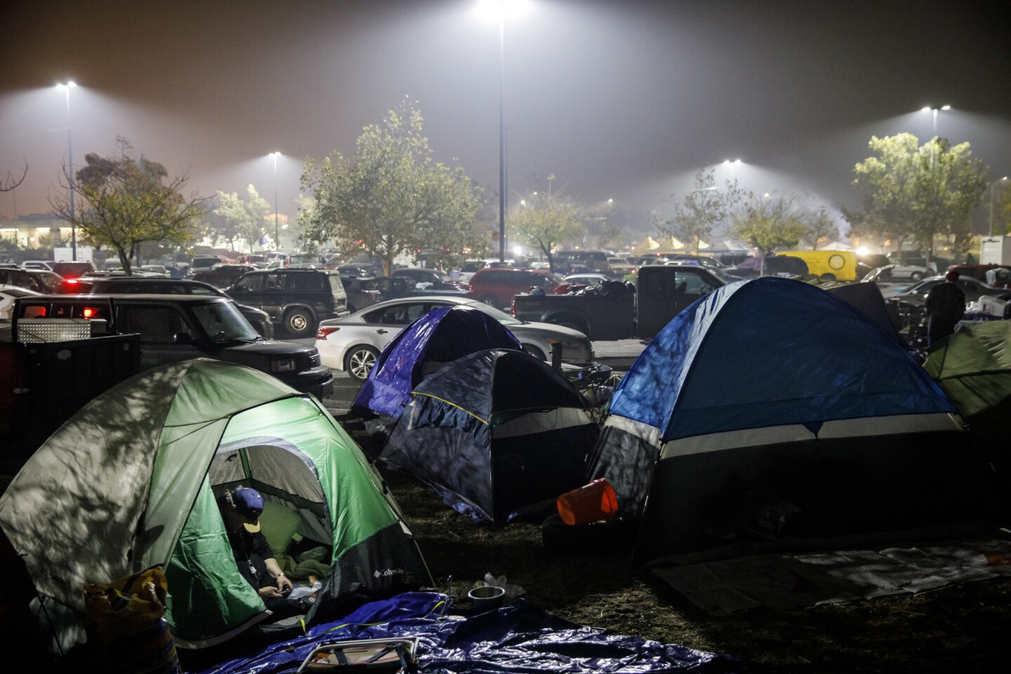 Evacuees from the camp fire set up a tent city at the Walmart parking lot in Chico, Calif.