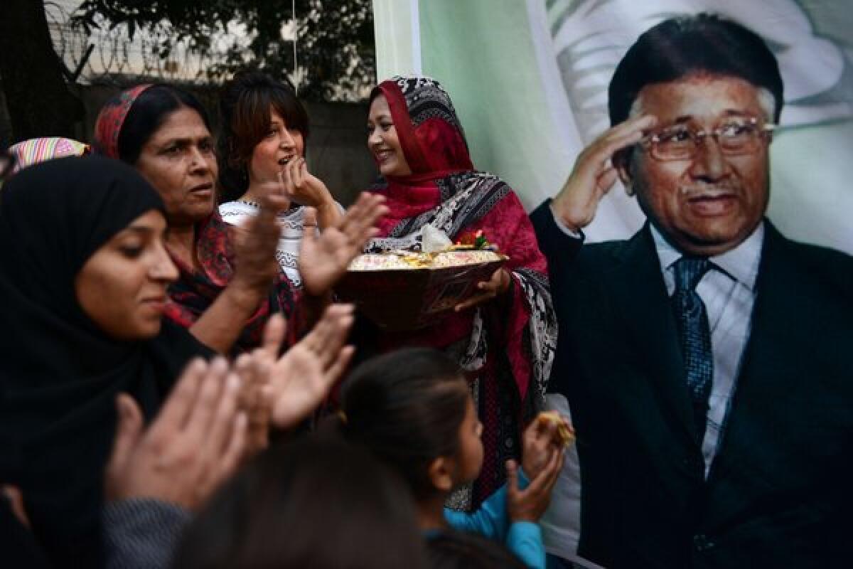 Activists with the All Pakistan Muslim League celebrate the granting of bail for former President Pervez Musharraf in connection with the death of a rebel leader, in Islamabad on Wednesday.