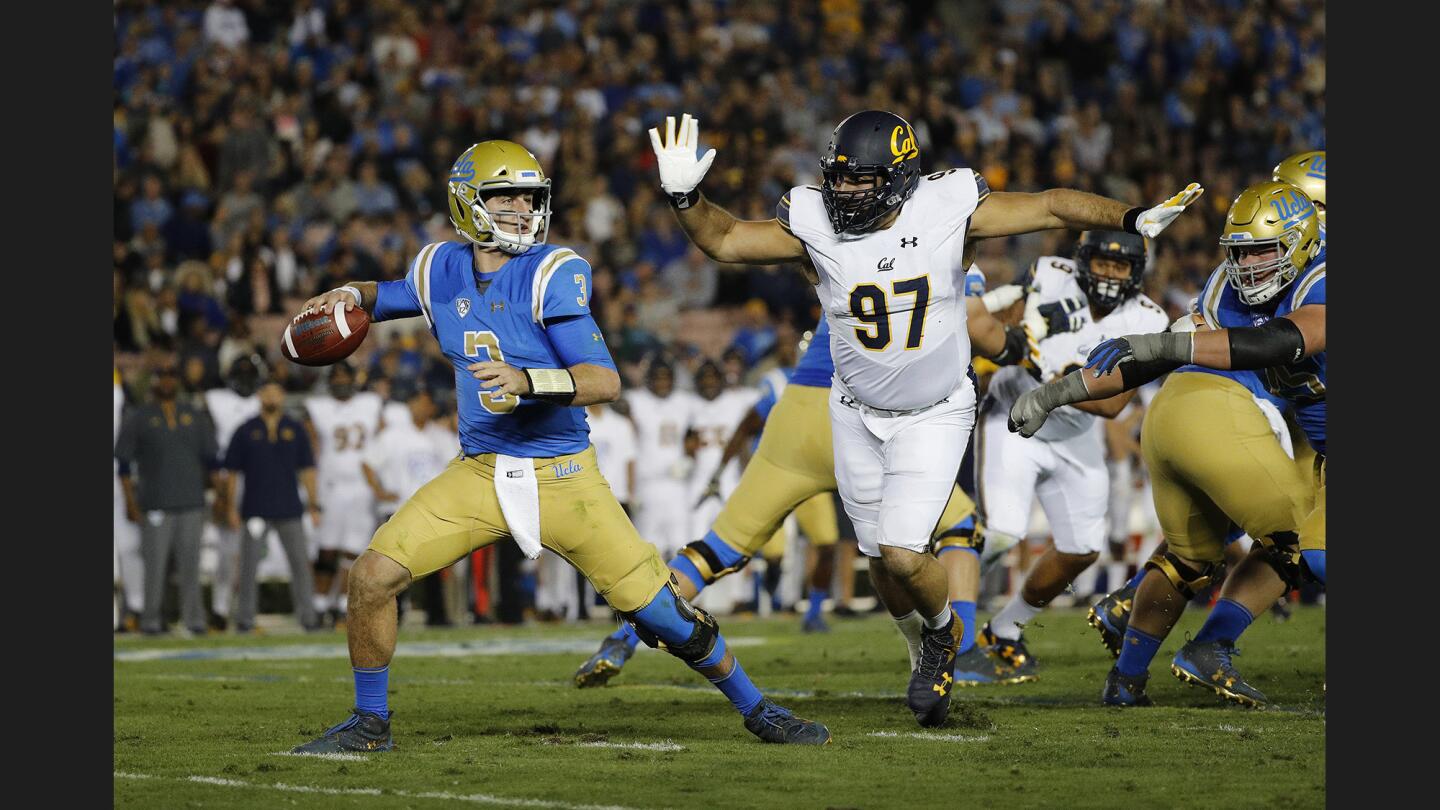 Bruins quarterback Josh Rosen (3) has little time to get a pass under pressure from Golden Bears nose guard Tony Mekari (97) during the first half.