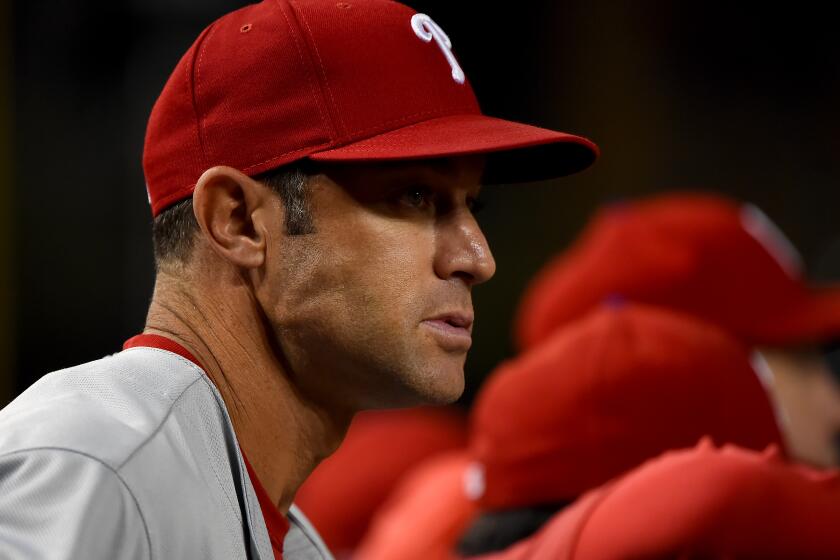 WASHINGTON, DC - SEPTEMBER 25: Manager Gabe Kapler #19 of the Philadelphia Phillies looks on from the dugout during the game against the Washington Nationals at Nationals Park on September 25, 2019 in Washington, DC. (Photo by Will Newton/Getty Images)