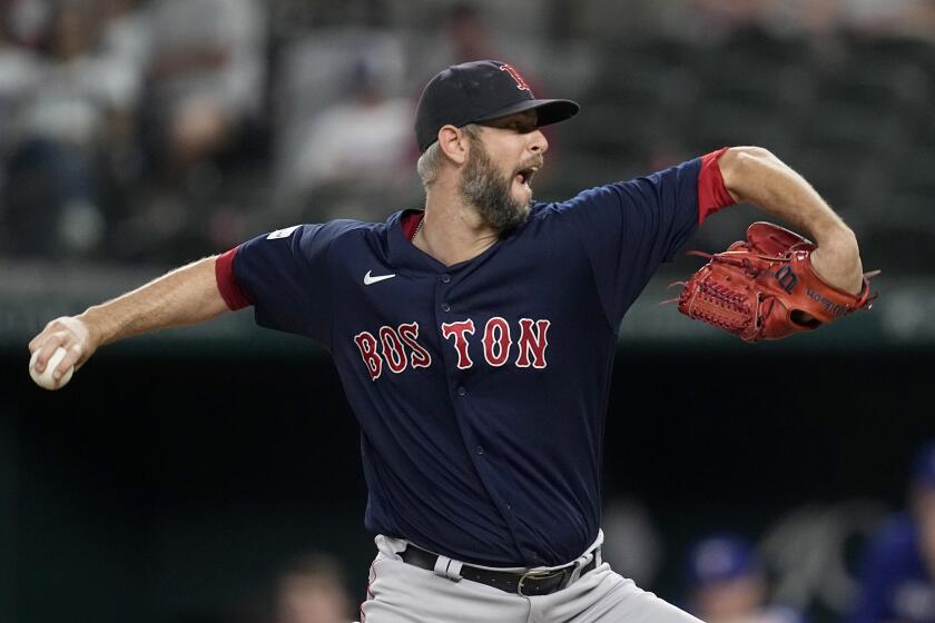 Boston Red Sox relief pitcher Chris Martin throws to the Texas Rangers in the ninth inning of a baseball game in Arlington, Texas, Monday, Sept. 18, 2023. (AP Photo/Tony Gutierrez)