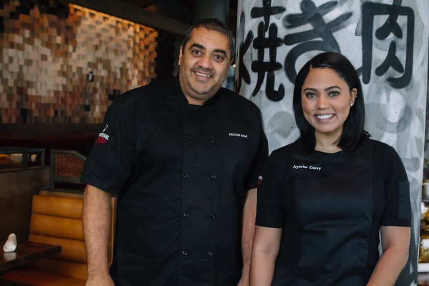 Michael Mina and Ayesha Curry are bringing their star power to San Diego with the opening of International Smoke at One Paseo.