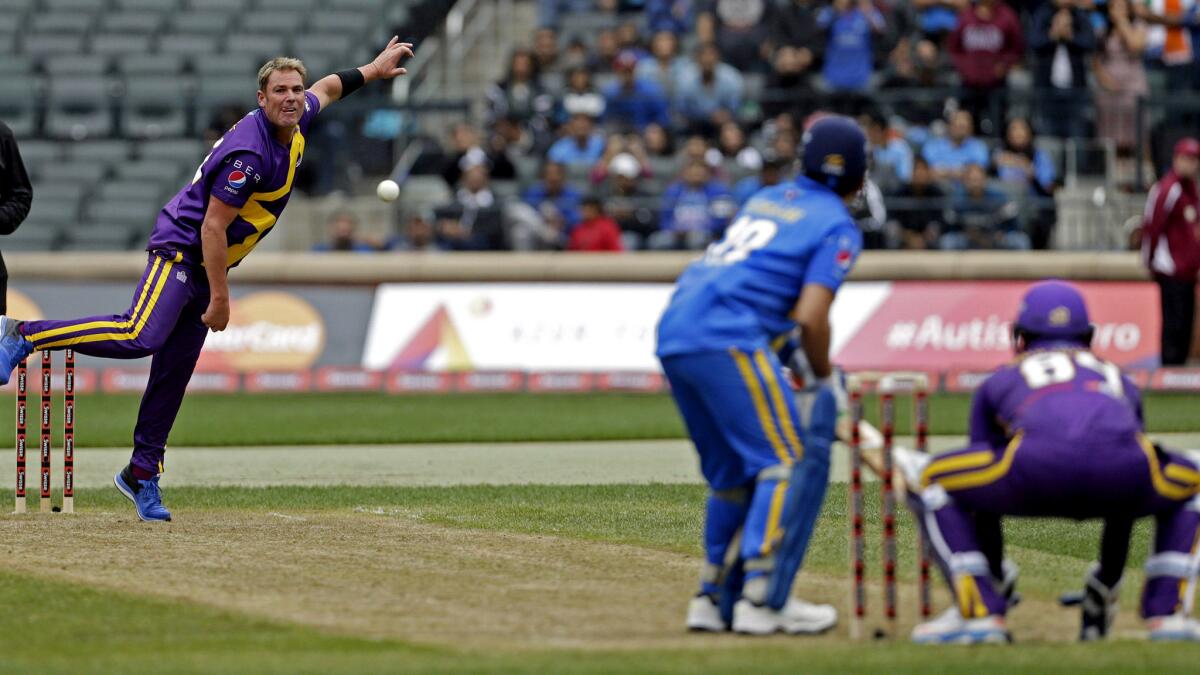 Shane Warne bowls to Sachin Tendulkar at the Cricket All-Stars series opener on Saturday at Citi Field in New York.