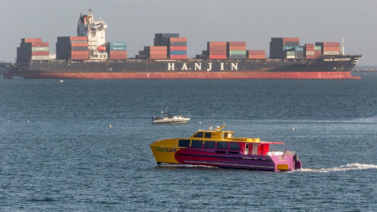 South Korea's Hanjin Shipping Co. container ship Hanjin Montevideo, top, is anchored outside the Port of Long Beach on Sept. 1.
