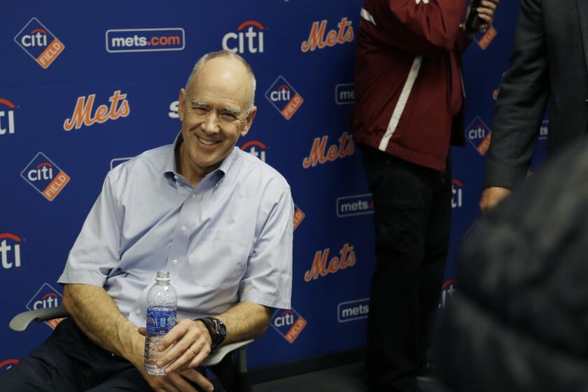 New York Mets General Manager Sandy Alderson rests in a chair after collapsing during a news conference Wednesday at Citi Field.