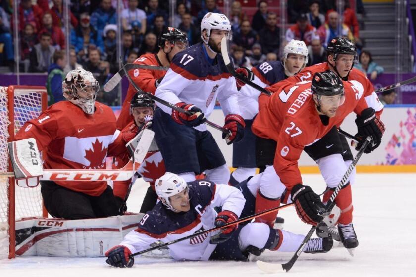The U.S. and Canada get in a scrum in front of Canada's net.