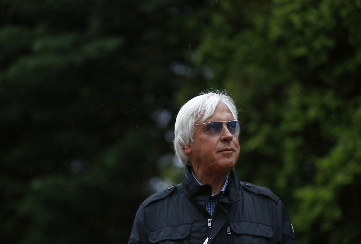 Bob Baffert stands outside in a jacket.