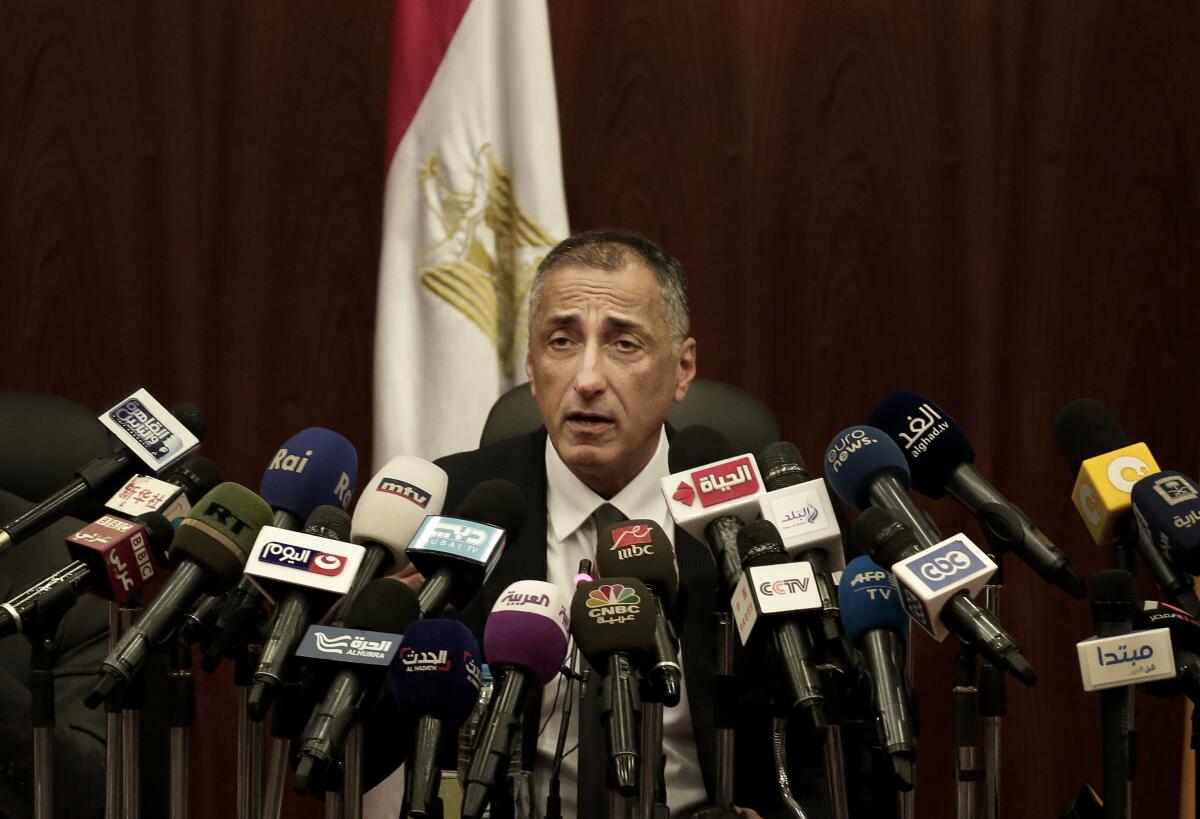 FILE - Egyptian Central Bank Governor Tarek Amer speaks during a press conference at the Central Bank of Egypt in Cairo, Nov. 3, 2016. Amer resigned as the country has struggled to address its financial woes. According to a Wednesday, Aug. 17, 2022 statement from President Abdel Fattah el-Sissi's office, el-Sissi accepted the resignation and named him a presidential adviser. The brief statement offered no reason for Amer’s resignation and no replacement was immediately named. (AP Photo/Nariman El-Mofty, File)