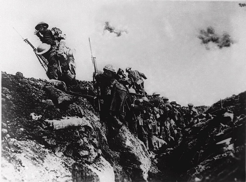 American soldiers go over the top during trench warfare at an unidentified battlefield in Europe during World War I.