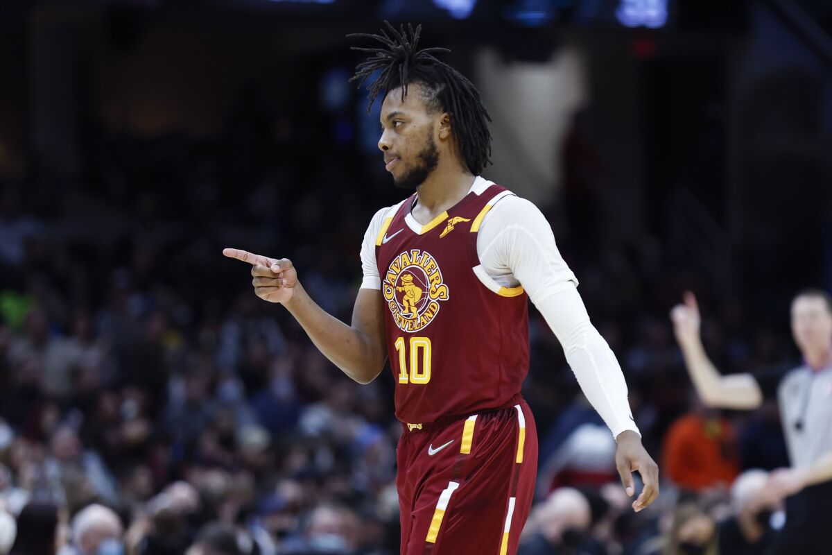 Cleveland Cavaliers' Darius Garland celebrates after a basket against the San Antonio Spurs during the second half of an NBA basketball game, Wednesday, Feb. 9, 2022, in Cleveland. The Cavaliers defeated the Spurs 105-92. (AP Photo/Ron Schwane)