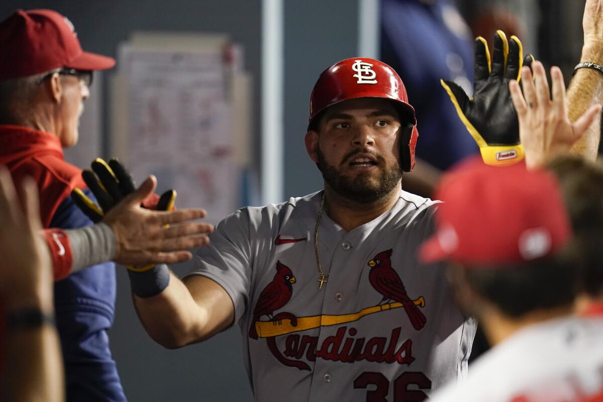 St. Louis Cardinals batter Juan Yepez celebrates in the dugout after hitting a home run in the seventh inning.