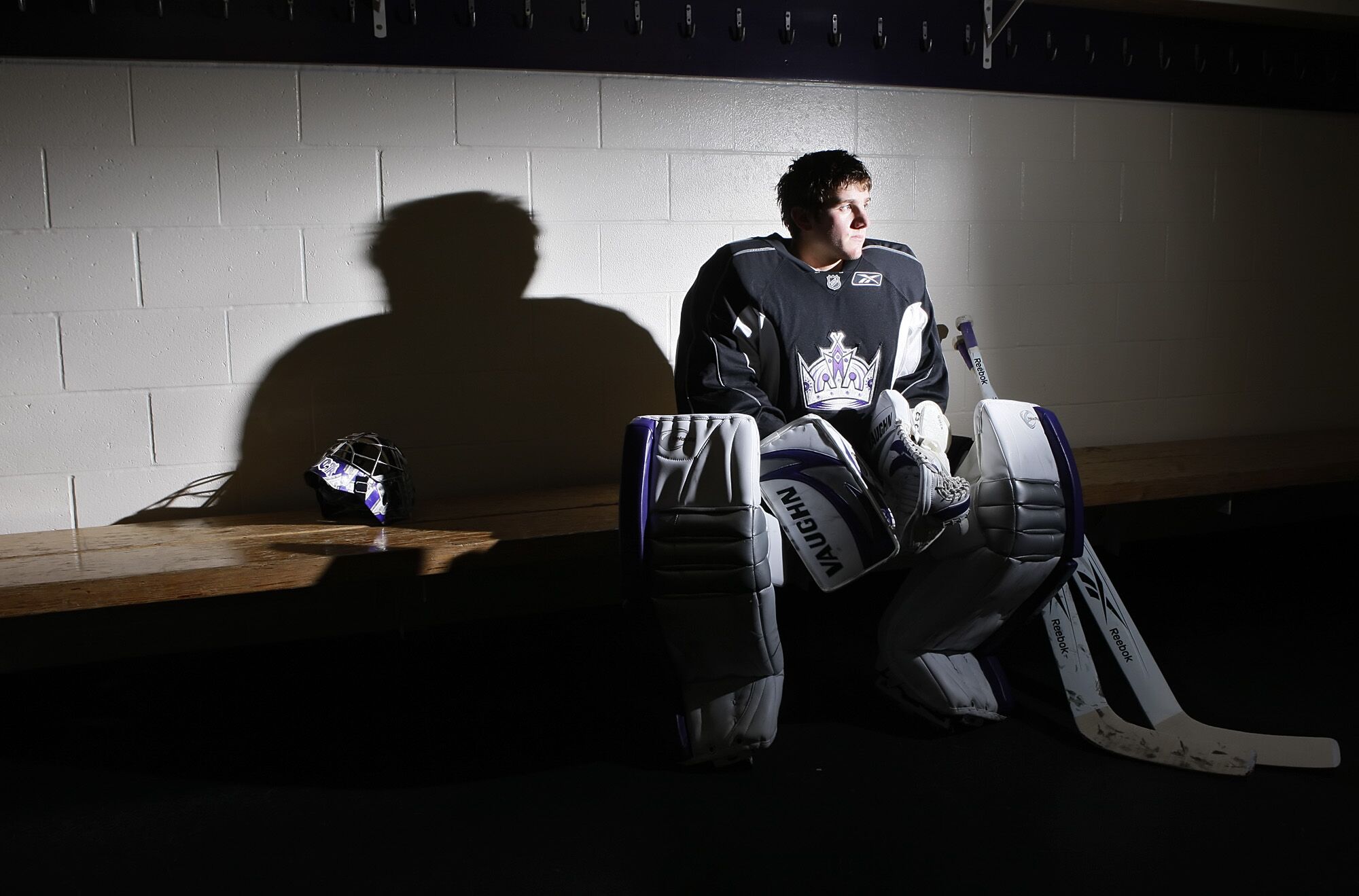 Kings goalie Jonathan Quick sits in his gear at the team's practice facility in El Segundo in December 2009.